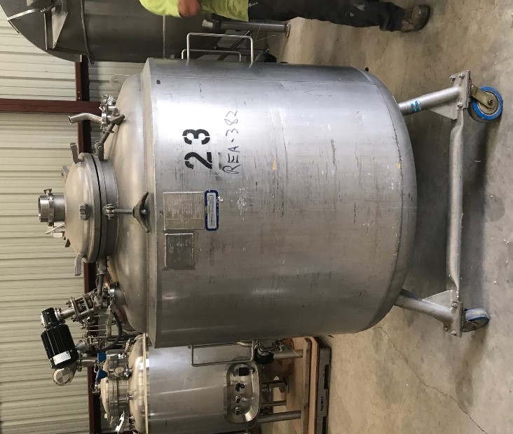 used 1000 Liter (264 Gal.) Stainless Steel Sanitary Pharmaceutical Grade Reactor/fermenter. Jacketed Mixing Tank. Internal Rated 40/Full Vacuum @ 300 Deg.F.. Jacket rated 100 PSI @ 300 Deg.F. Mounted on Wheels with Center Bottom Discharge, Agitator with 3/8 HP Motor 230V, 3 ph. Built by Apache/Precision Stainless Equipment.  Overall Dimensions: Approx. 80